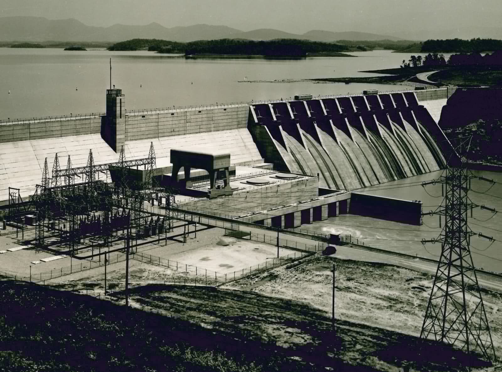 Substation and transmission lines below a hydroelectric dam